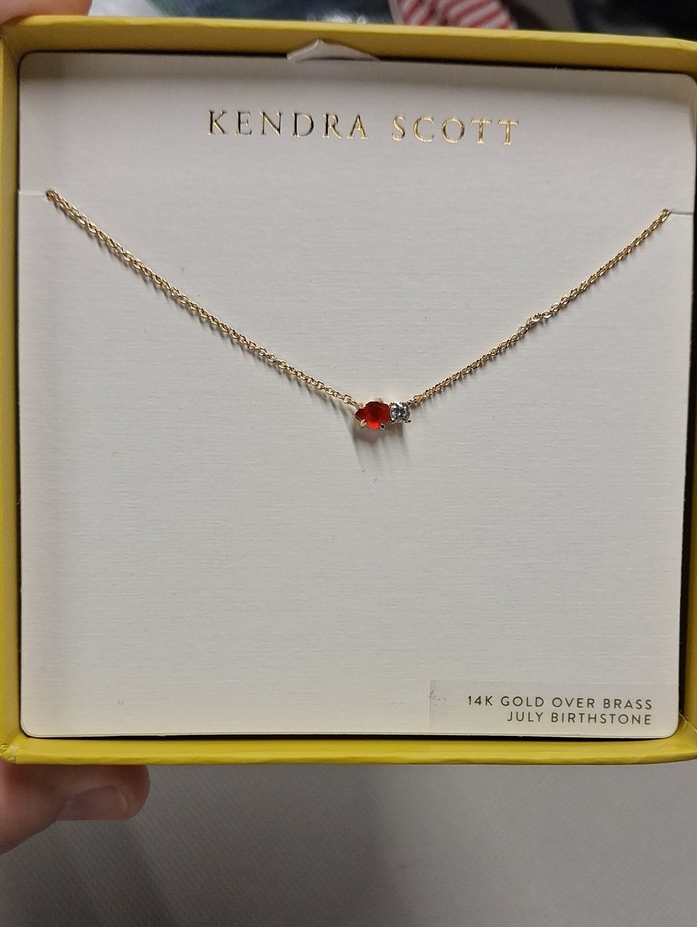 Kendra Scott Gold Necklace with Red Gem and Clear Accent